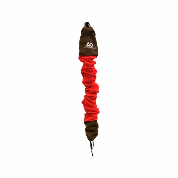 Sturdy red and brown bungee cord for camping and outdoor gear securement.