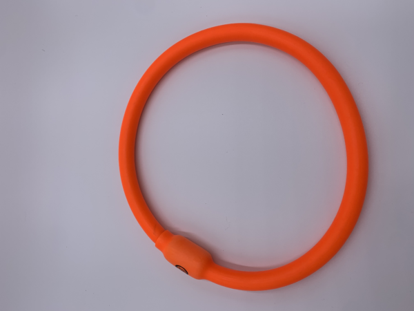 Vibrant orange flexible ring, ideal for fitness, exercise, or playful activities.